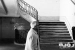 grayscale photography of man walking near staircase 1483482 scaled