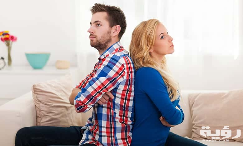 angry young couple sitting back back home